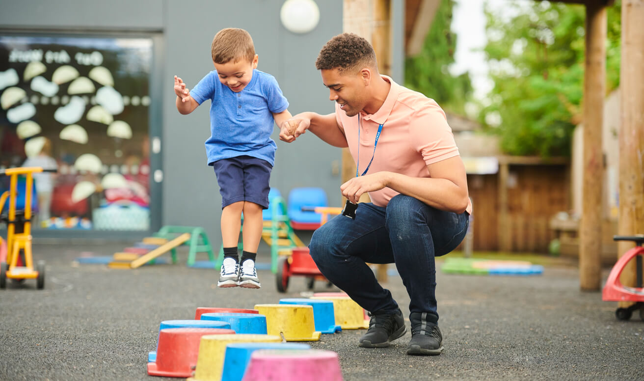 Behavioral clinician working with autistic-spectrum boy